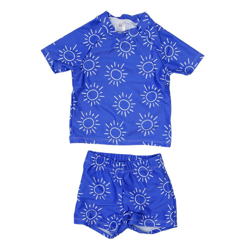 Vaikiškas dviejų dalių mėlynas maudymosi kostiumėlis su baltomis saulutėmis