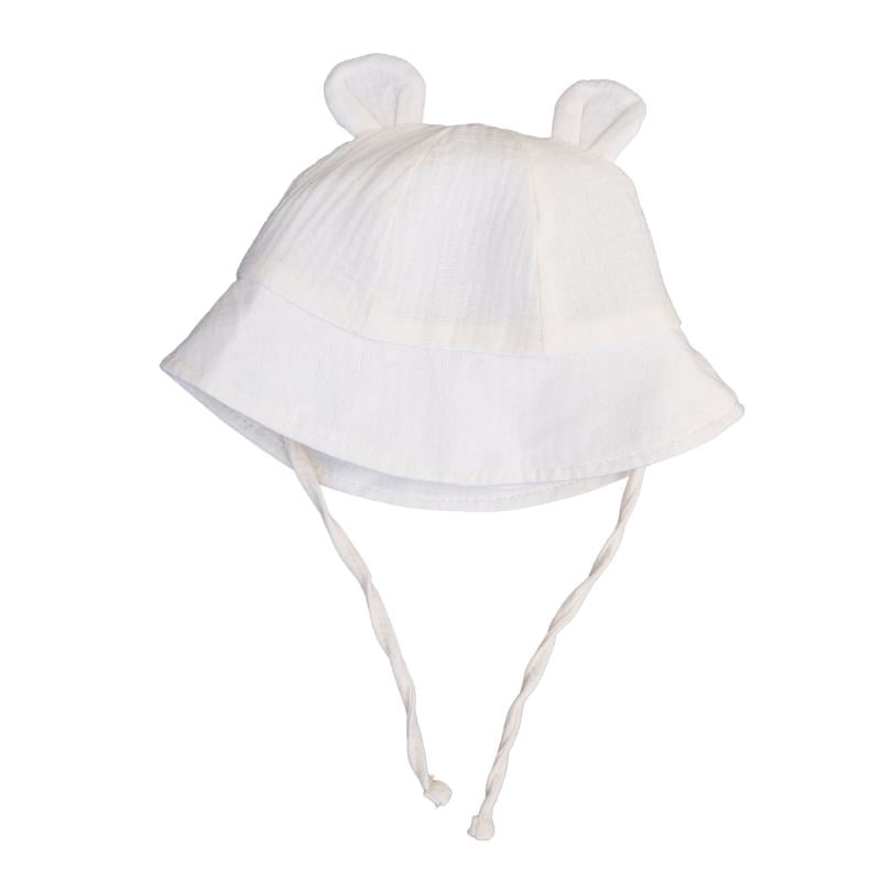 Kreminė vaikiška kepuraitė su ausytėmis ir raišteliais Kreminė 100% medvilnės vaikiška kepuraitė